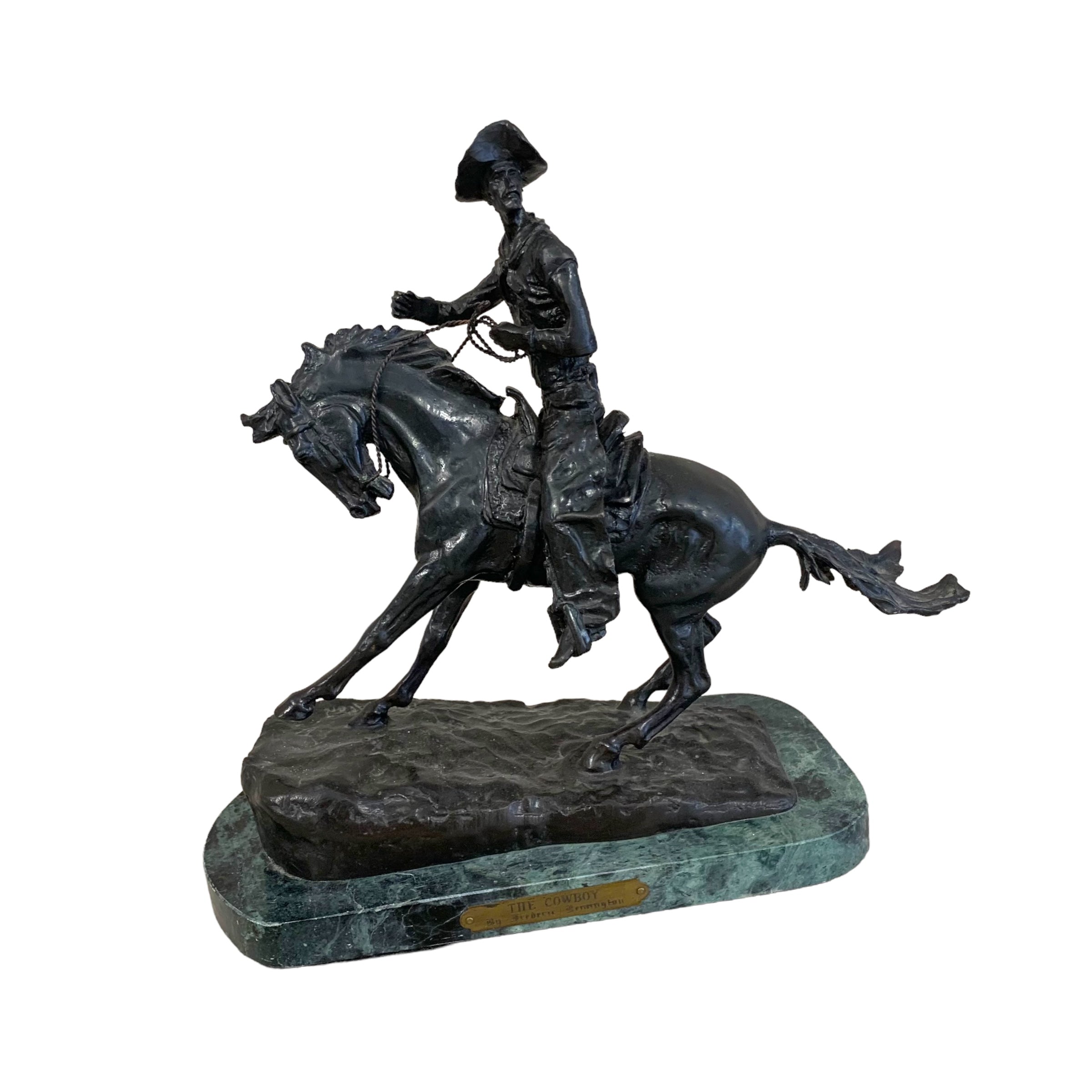 Escultura bronce "cowboy" firmado Frederick Remington. SXIX