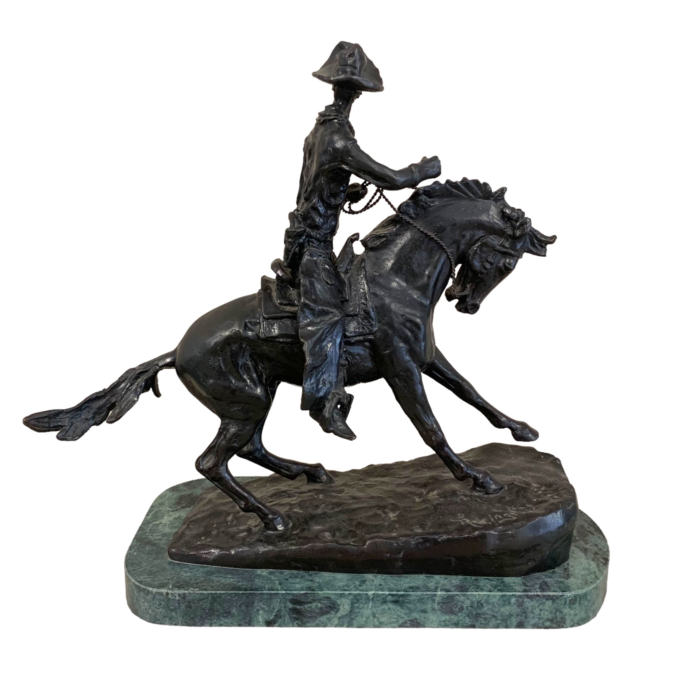 Escultura bronce "cowboy" firmado Frederick Remington. SXIX