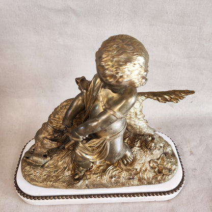 Bronce francés de niño sujetando perro. SXIX