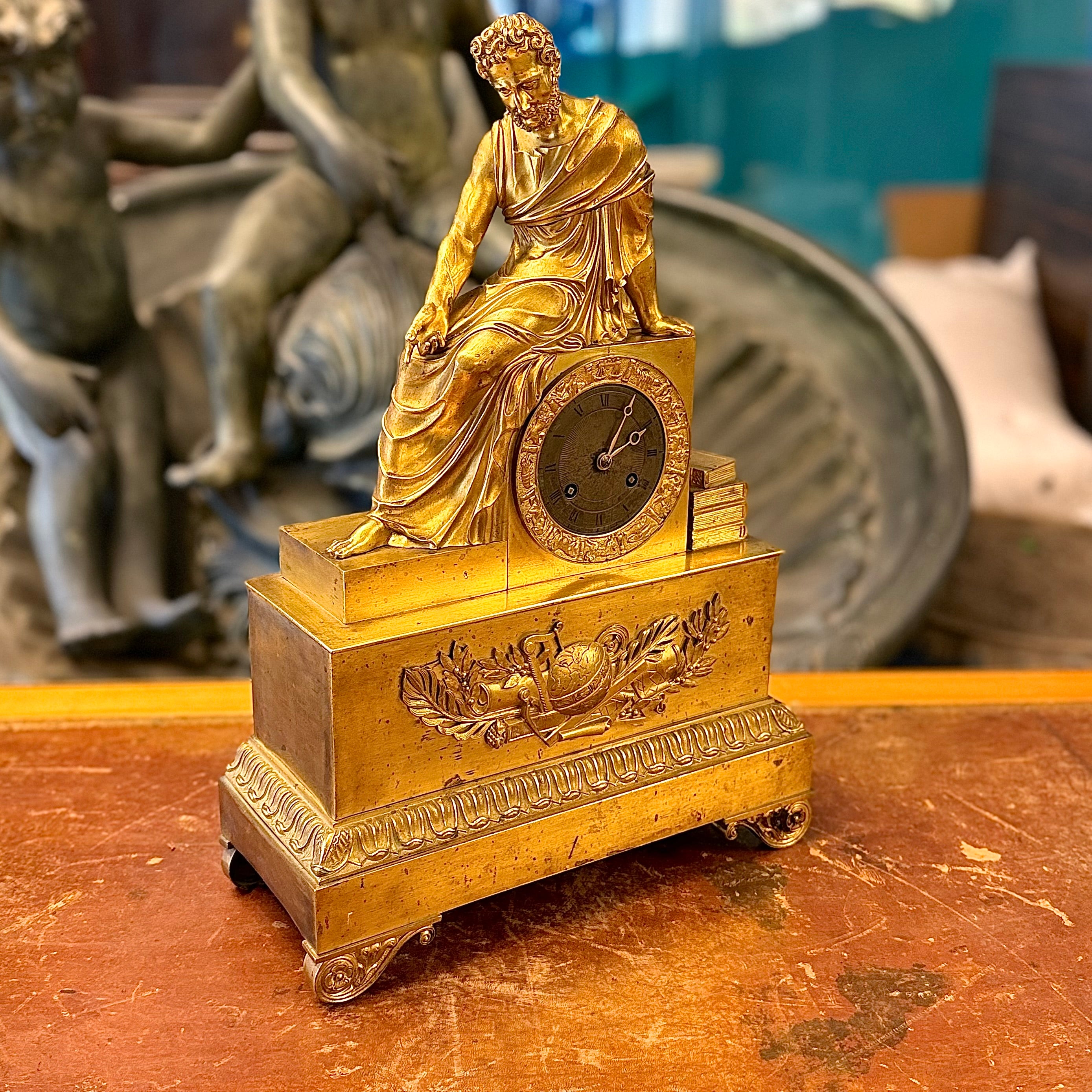 Reloj de bronce época Napoleón III mostrando a Homero. Francia SXIX