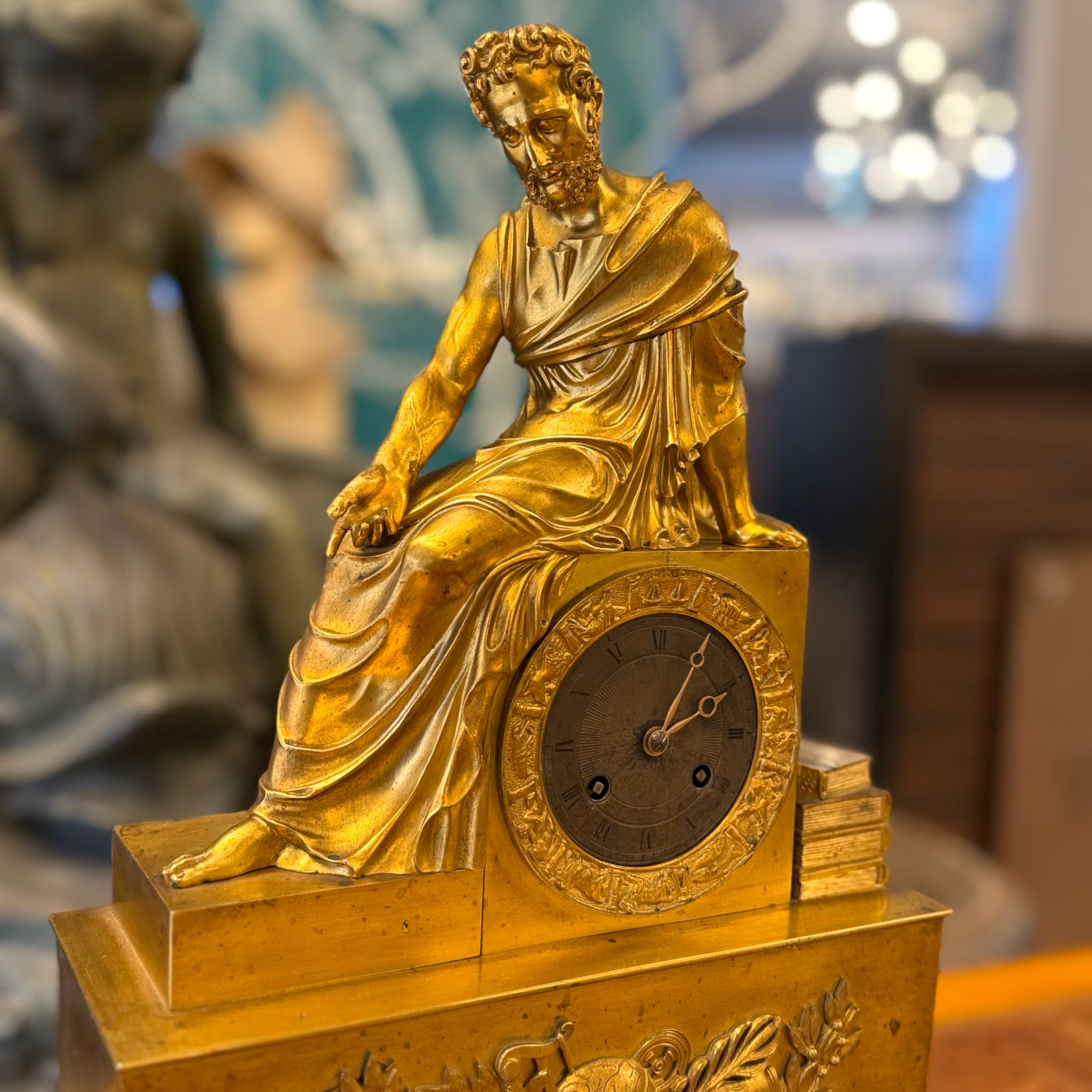 Reloj de bronce época Napoleón III mostrando a Homero. Francia SXIX